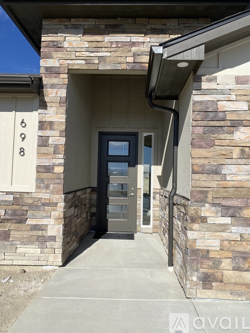 A stone building with a number 698 on the left.