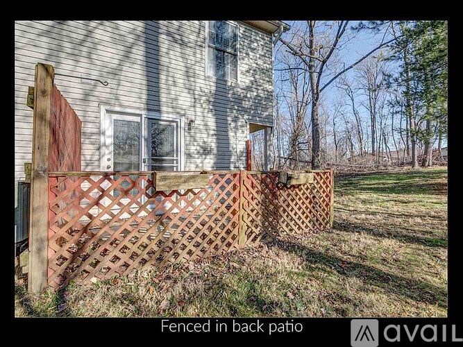 A wooden fence in front of a house.