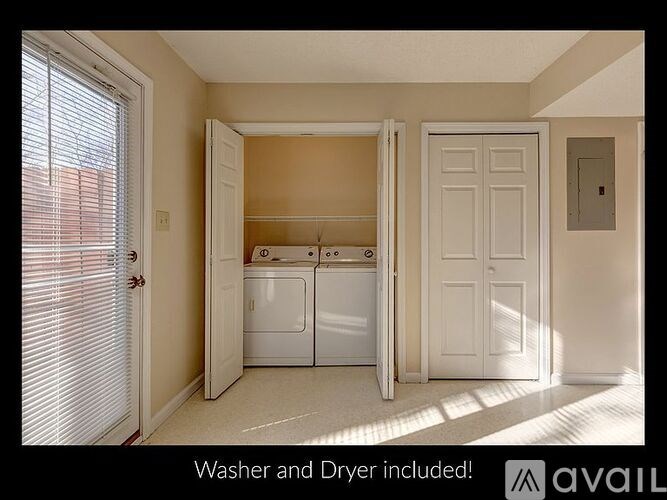 A laundry room with a washer and dryer included.