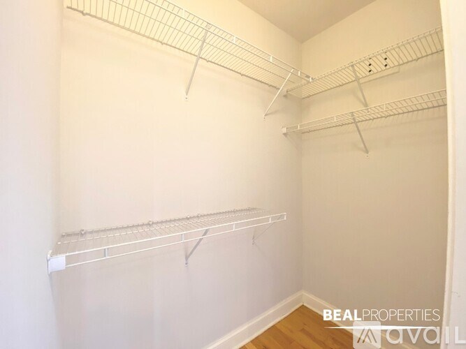 Empty white shelving unit in a room.