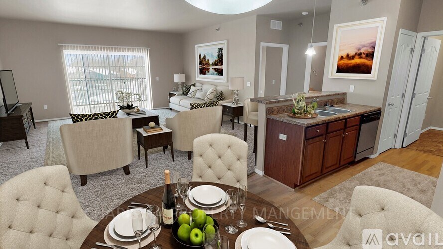 A well-furnished living room with a dining area and a kitchen in the background.