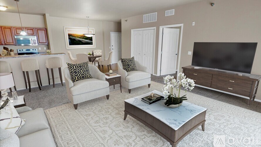 A living room with a sofa, armchair, and coffee table.