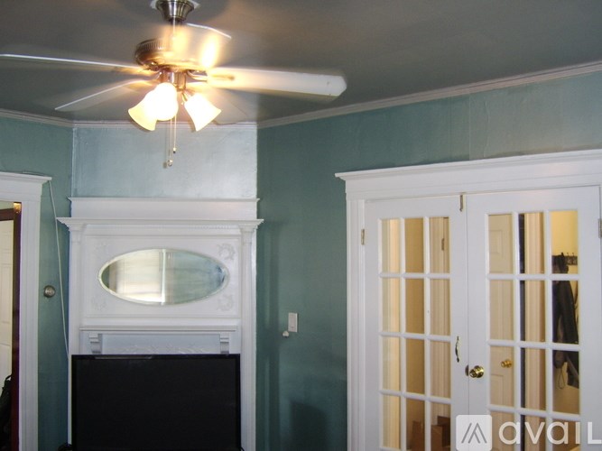 A white door with a glass panel is on the right side of the image.
