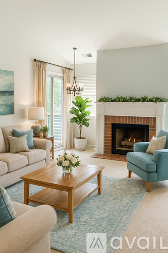 A living room with a fireplace, a couch, a chair, a coffee table, and a plant.