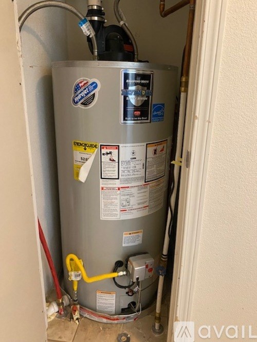 A water heater is installed in a room.