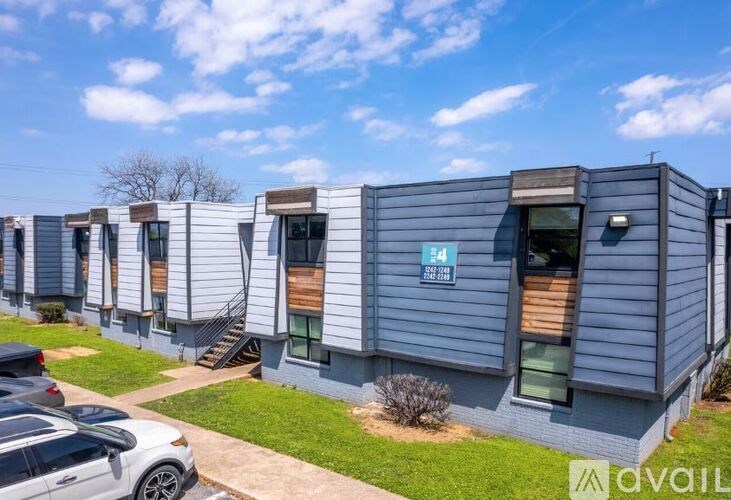 A row of modern houses with the number 34 on the first one.