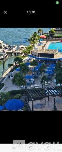A view of a pool area with a waterfront.