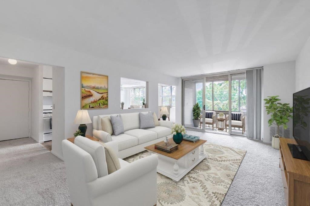 a living room with a white couch and a table