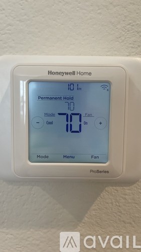 A Honeywell Home ProSeries thermostat is set to 71 degrees Fahrenheit.