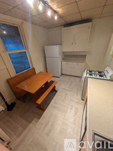 A room with a wooden floor and a ceiling fan.