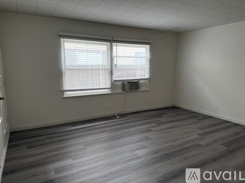 A room with a ladder and a fan.