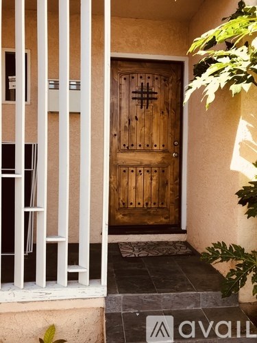 A wooden door with a cross design on it.
