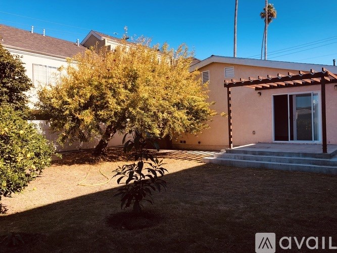 A house with a tree in front of it.