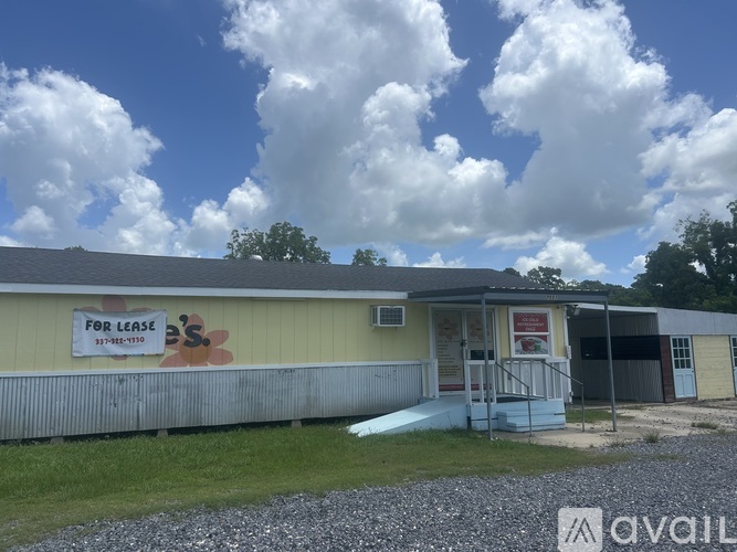A building with a sign that says "For Lease" is available for rent.