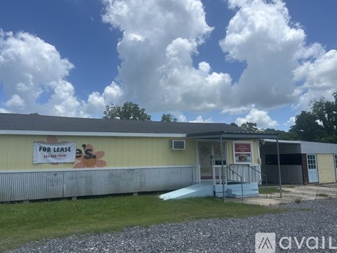 A building with a sign that says "For Lease" is available for rent.