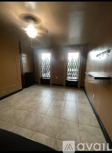 A kitchen with a microwave on top of a fridge and a dishwasher.