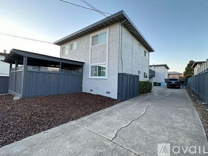 A house with a driveway in front of it.