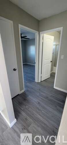 A room with a grey floor and white walls.