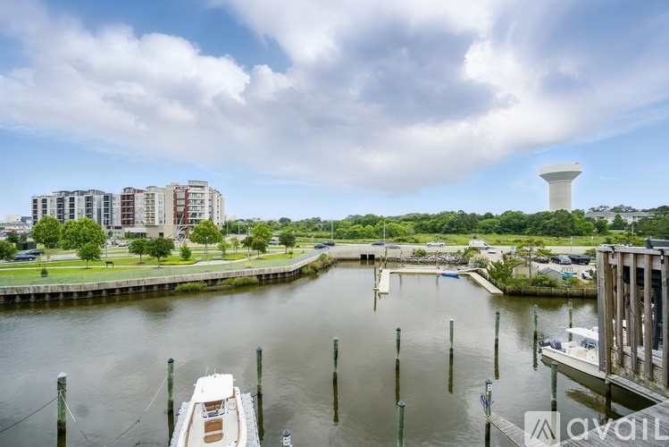 A boat is docked at a pier in a marina.