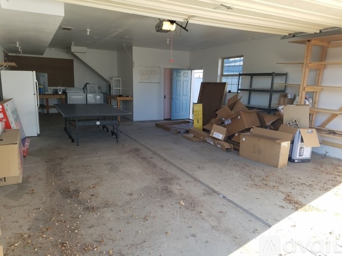 A room with a lot of boxes on the floor.