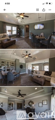 A living room with a brown couch and a ceiling fan.
