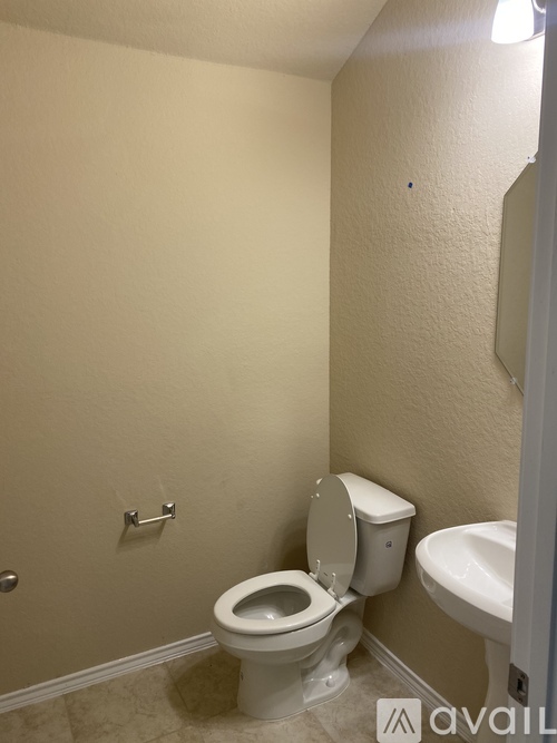 A bathroom with a toilet and a bidet.