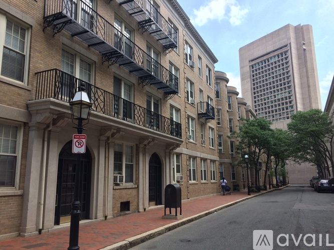 A street view of a building with a no parking sign.