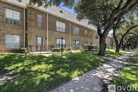 A kitchen with a white fridge and a white microwave above the stove.