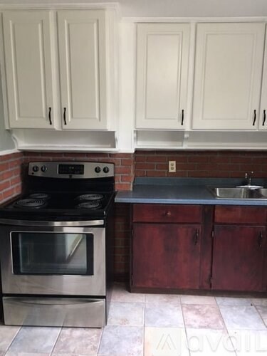 A kitchen with a stove and oven.