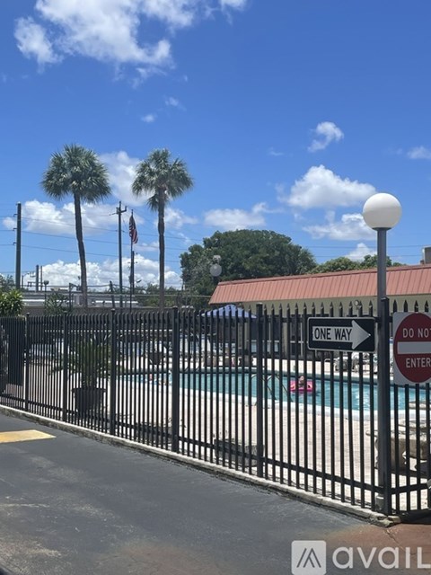 A black fence surrounds a pool with a "Do Not Enter" sign in the background.