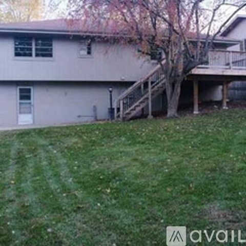 A house with a tree in front of it.