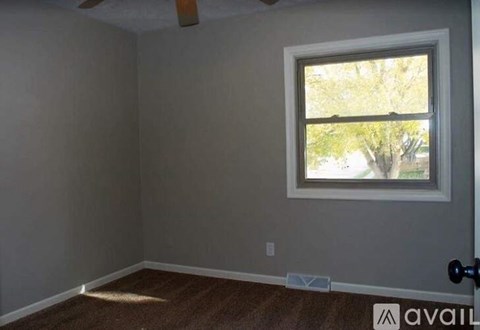 A room with a window and a door.