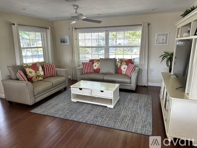 A living room with two couches and a coffee table.