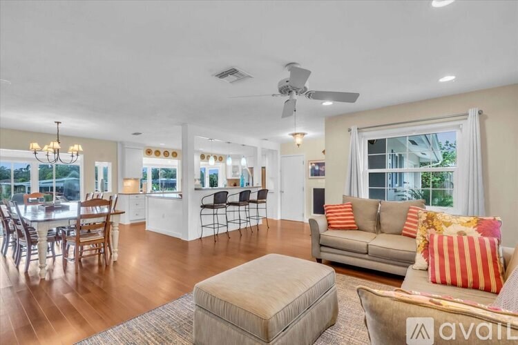 A shower area with a glass door and a shower head.