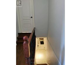 A hallway with a door at the end.