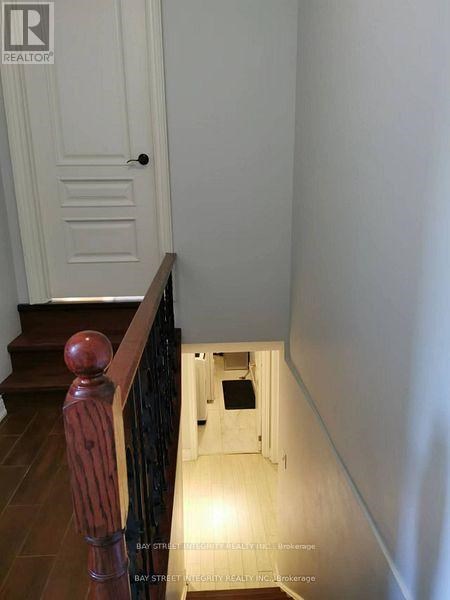A hallway with a door at the end.