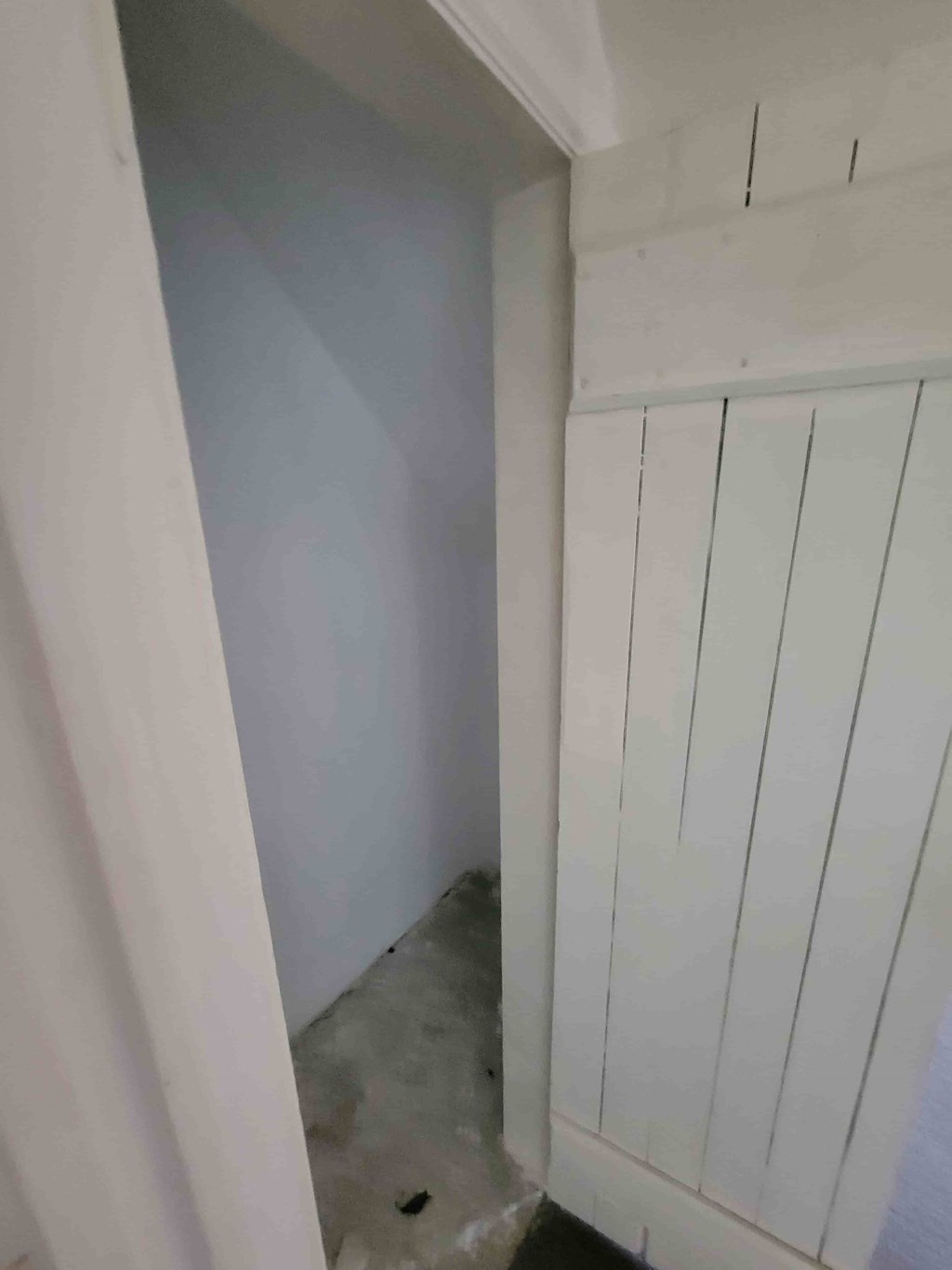 A white door with a white frame.
