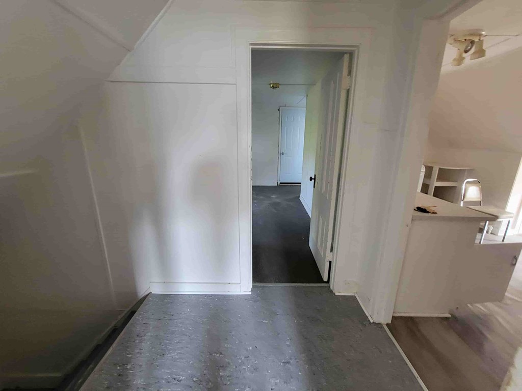 A room with a doorway leading to another room.