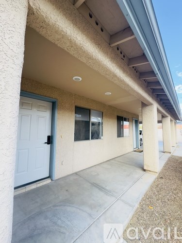 A row of houses with a blue sky in the background.