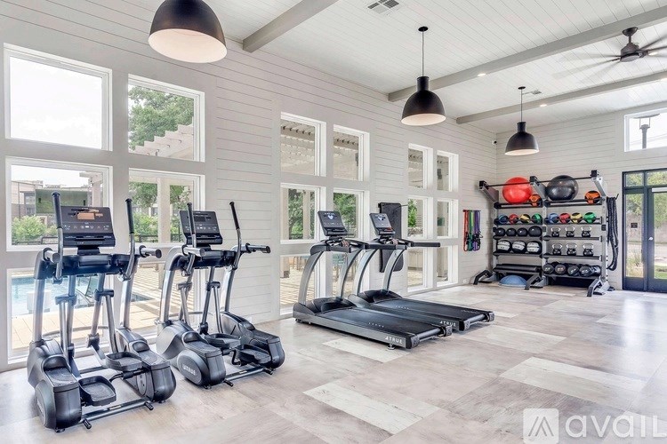 A walk-in closet with shelves and a carpeted floor.