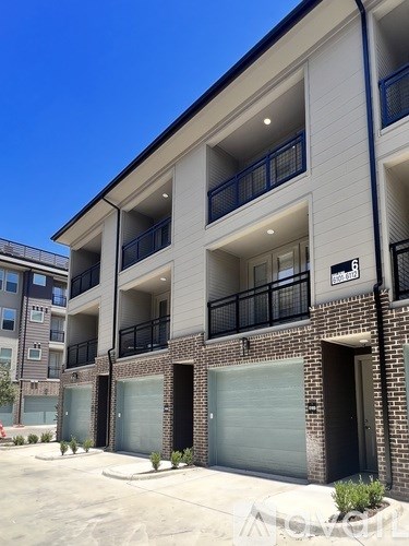 Apartment building with a clear blue sky in the background.