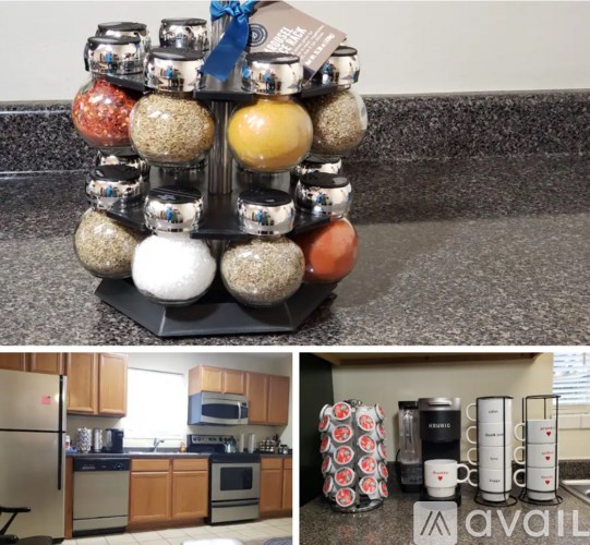 A kitchen with a spice rack and a refrigerator.