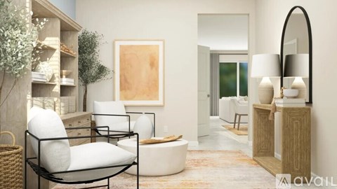 A living room with a white chair and a lamp.