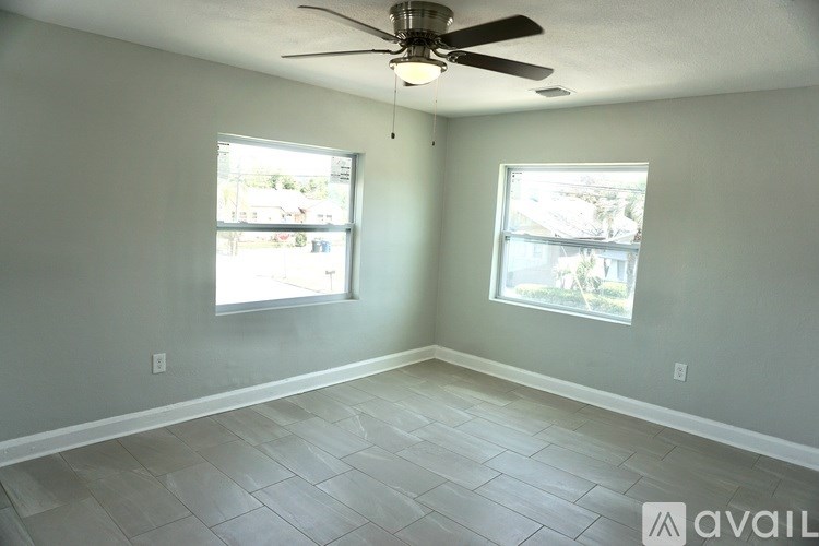 A bathroom with a marble tub and sink.