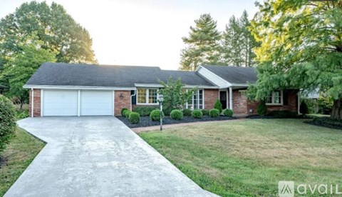 A house with a driveway in front of it.