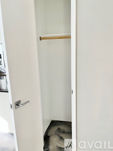 A white door with a handle and a small gap at the bottom.