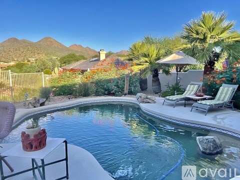 A pool with a view of the mountains.