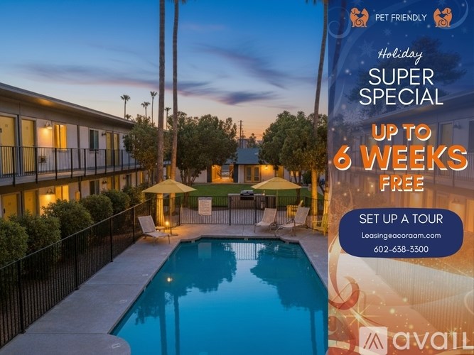 A living room with a couch, a fan, and a mirror on the wall.