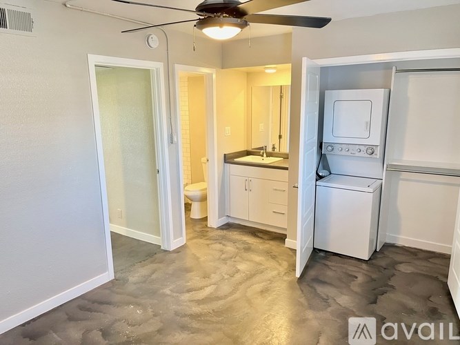 A small, clean, and well-organized kitchen with a washer and dryer built in.
