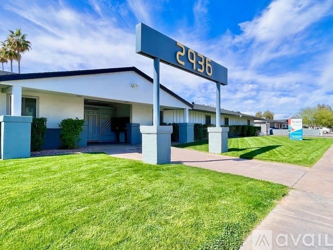 A building with the number 2936 on a sign in front of it.